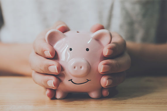 Man holding a piggy bank